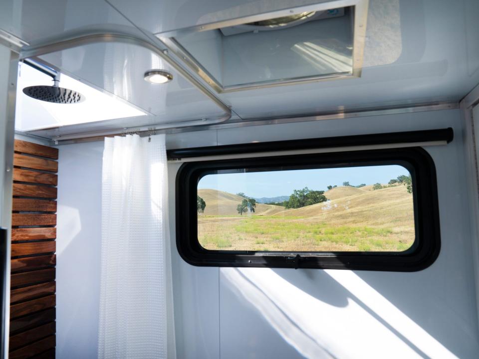 A window showing a field outside.