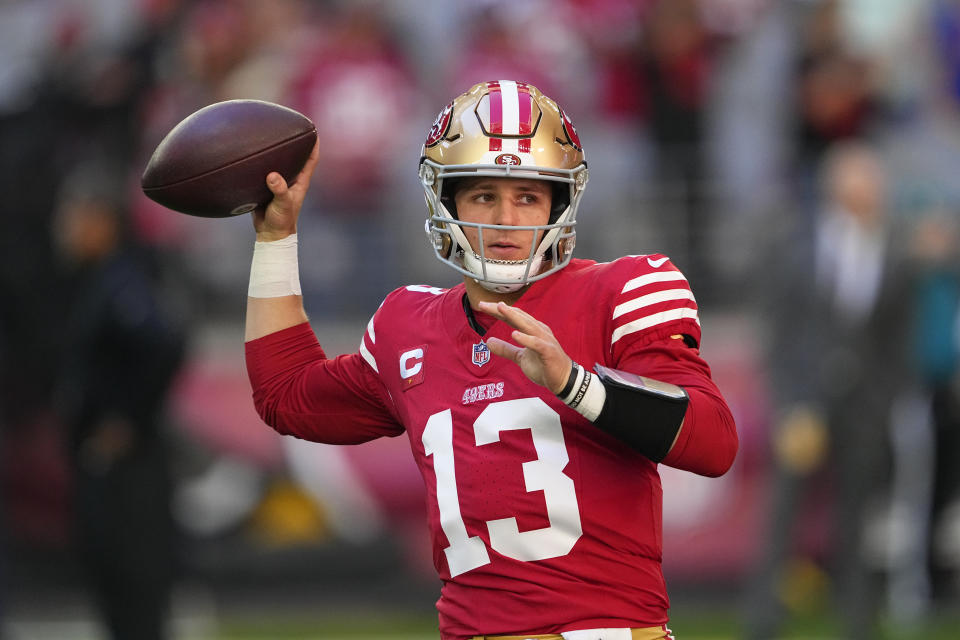 San Francisco 49ers quarterback Brock Purdy (13) warms up before an NFL football game against the Arizona Cardinals Sunday, Dec. 17, 2023, in Glendale, Ariz. (AP Photo/Matt York)