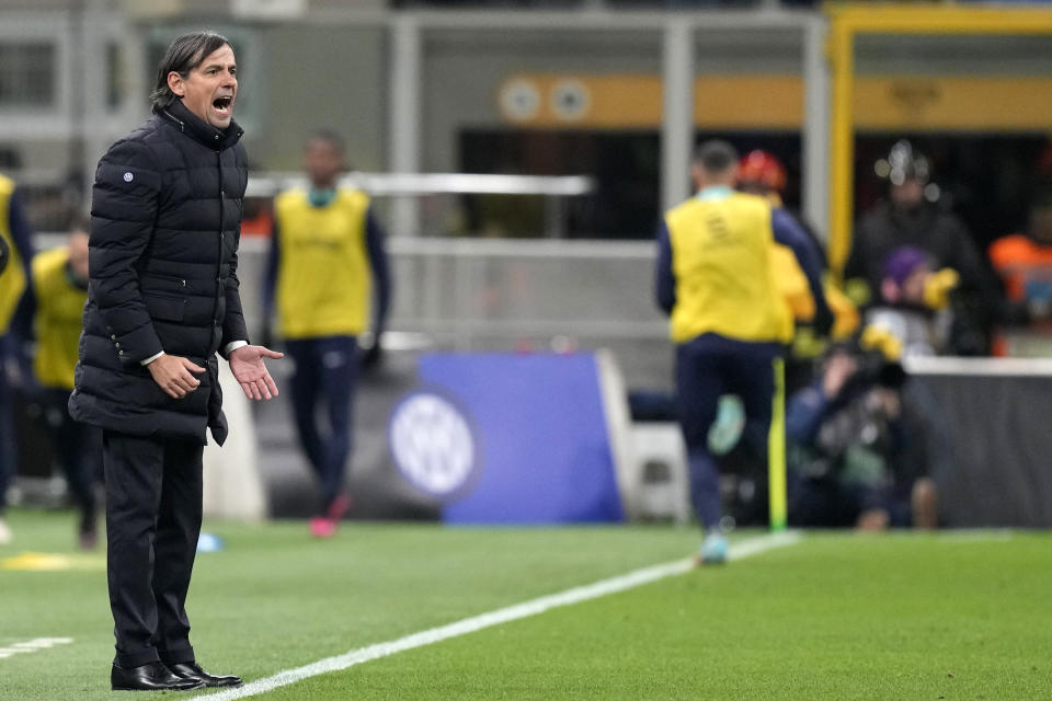 Inter Milan's head coach Simone Inzaghi gives instructions to his players during the Serie A soccer match between Inter Milan and AC Milan at the San Siro Stadium, in Milan, Italy, Sunday, Feb. 5, 2023. (AP Photo/Antonio Calanni)