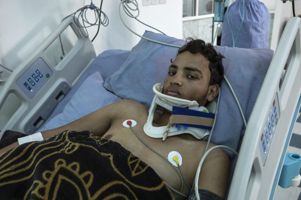 Yemeni fighter 22-year-old Ali Saad, who was recently wounded in clashes with Houthi rebels, receives treatment at the intensive care unit in Marib Hospital in Yemen, Monday, June 21, 2021. Saad has been fighting in government forces since 2017. During that time, he and his family fled their home in southwestern Dhamar province as the war escalated there. Later, he was captured and held for a year in a Houthi prison until he was released in an October prisoner exchange. (AP Photo/Nariman El-Mofty)
