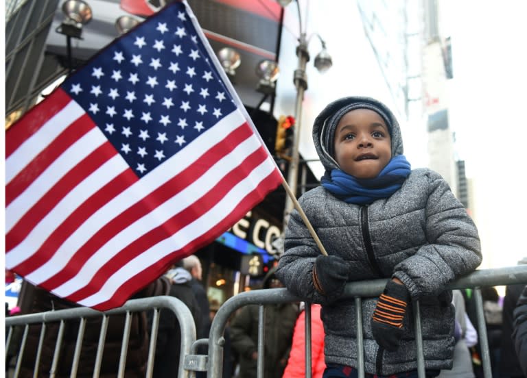 Kamarii Wickenson, 6, takes part in a demonstration in New York on Martin Luther King Jr Day with the theme of "Rally Against Racism: Stand Up for Haiti and Africa"