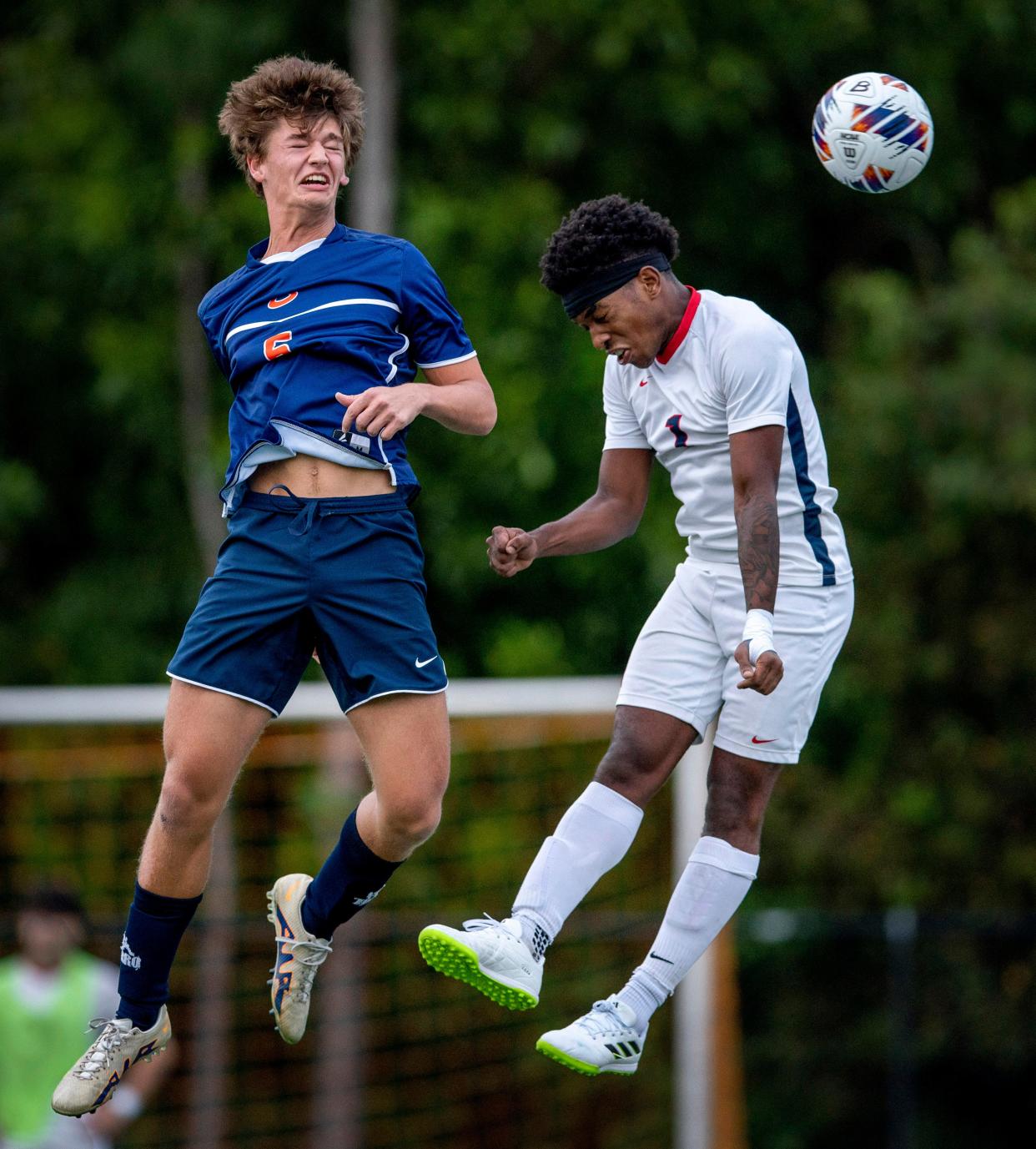 Benjamin's Joshua Luiz, left, competes for the ball against Oxbridge Academy Julien Dorsey.