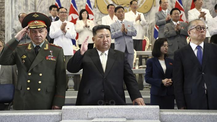 Russian Defence Minister Sergei Shoigu; North Korean leader Kim Jong Un; and China&#39;s vice chairman of the standing committee of the country&#x002019;s National People&#x002019;s Congress, Li Hongzhong, attend a military parade to mark the 70th anniversary of the armistice that halted fighting in the Korean War. (Korean Central News Agency/Korea News Service via AP)