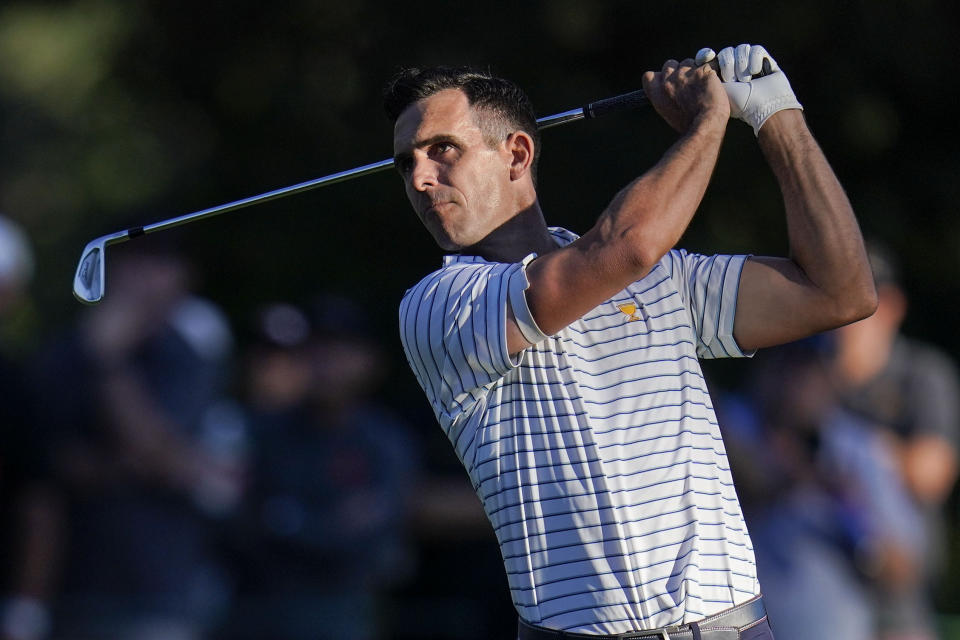 Billy Horschel hits from the 17th fairway during their fourball match at the Presidents Cup golf tournament at the Quail Hollow Club, Friday, Sept. 23, 2022, in Charlotte, N.C. (AP Photo/Julio Cortez)