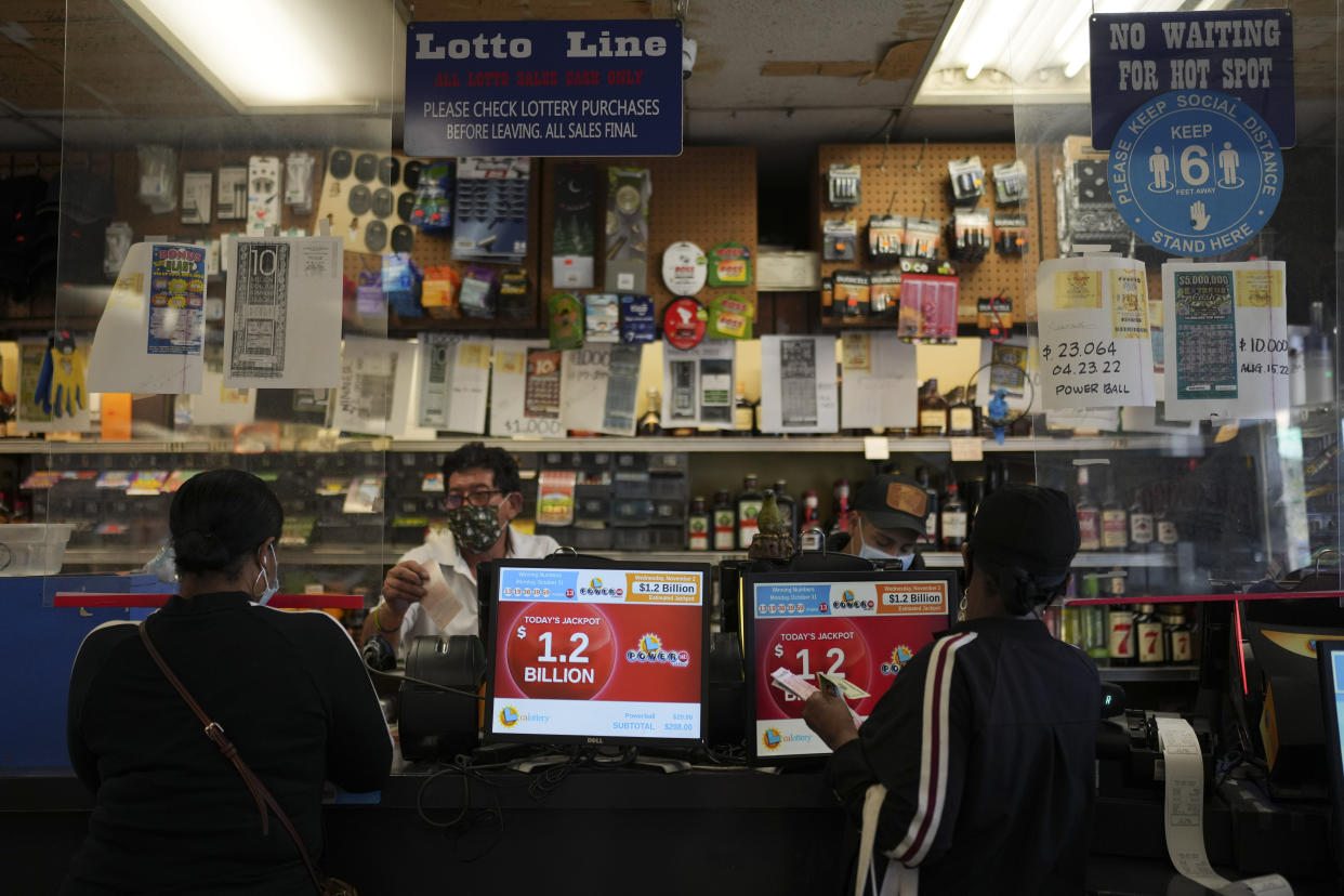 The Powerball jackpot amount is shown on displays at Bluebird Liquor in Hawthorne, Calif., Wednesday, Nov. 2, 2022. The fourth-largest lottery jackpot in U.S. history could soar to the largest ever if no one wins the top prize in Wednesday night's Powerball drawing. The jackpot climbed over a billion after no one matched all six numbers Monday night to win the jackpot. (AP Photo/Jae C. Hong)