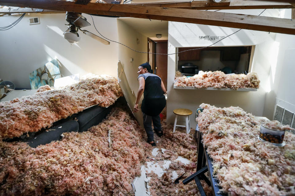 Erica Bohannon, leads reporters through her destroyed apartment after a tornado storm system passed through the area the night before, tearing her roof off while she huddled with her son and dog in her bedroom closet, Tuesday, May 28, 2019, in Trotwood, Ohio. (Photo: John Minchillo/AP)