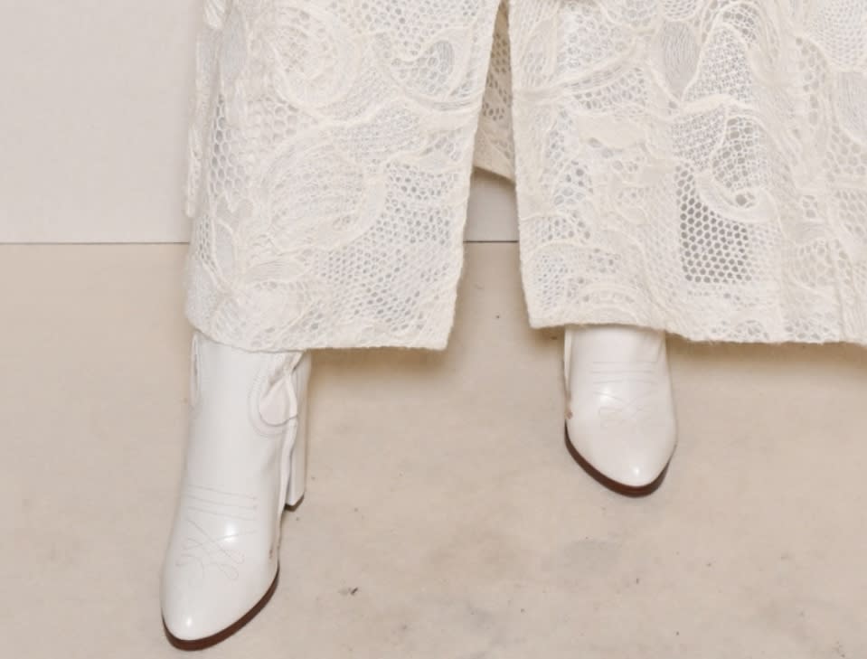 A closer look at the white boots worn by Ellie Goulding at the Elie Saab fashion show