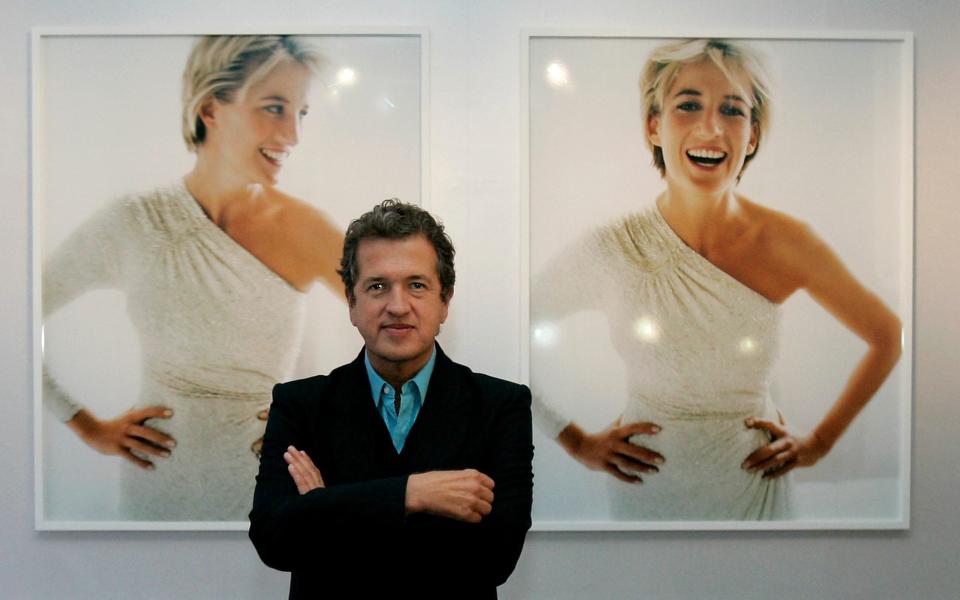 Mario Testino stands in front of his portrait of the Princess of Wales - a clear inspiration for the Duchess in her own images