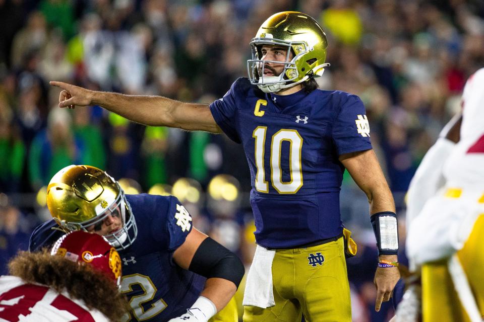 Notre Dame quarterback Sam Hartman (10) signals at the line of scrimmage during the first half an NCAA college football game against Southern California Saturday, Oct. 14, 2023, in South Bend, Ind. (AP Photo/Michael Caterina)