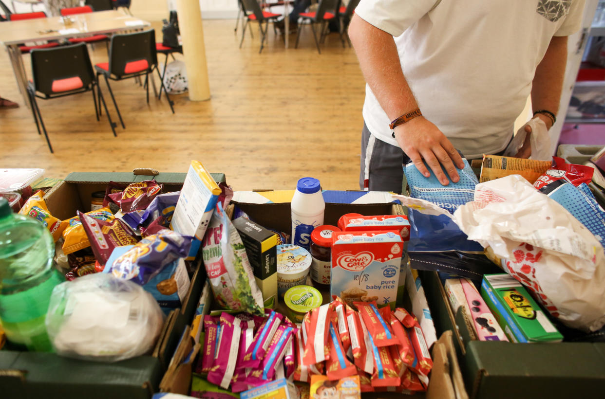 CAMBORNE, UNITED KINGDOM - JULY 25:  Liam Jervis, 21, who has been living in his car as he cannot afford local rents from the wages he earns from his low paid job, uses the foodbank run by the charity Transformation CPR being run at the Camborne Centenary Methodist Church in Camborne on July 25, 2017 in Cornwall, England.  Transformation CPR is run by local churches and oversees and develops social care projects in the Camborne, Pool and Redruth area in partnership with other agencies.  The foobank  is currently providing  between 8000 and 10,000 meals every month to people who cannot afford to feed themselves and their families. Figures released by Eurostat in 2014 named the British county of Cornwall as one of Europe's top ten poverty areas falling behind Poland, Lithuania and Hungary. Average wages were £14,300 compared with the UK national figure of £23,300 and £20,750 across Europe. UK government statistics show almost a quarter of people living in the Camborne, Pool and Redruth (CPR) area of Cornwall are in one of the most deprived areas of England with the highest level of childhood obesity, almost a quarter of children aged under 16 living in poverty and the lowest life expectancy.  The area, which has long suffered from severe industrial decline with the demise of the copper and tin mining industries, has not shared in the wealth created in nearby tourist havens such as Newquay, Padstow and St Ives.  Cornwall is the only UK county to have previously received emergency funding from the European Union (EU) and was one of the major beneficiaries of the UK's membership of the EU due to the large amount of funding made available through the EUs Objective One and Convergence programmes.  Despite this voters overwhelmingly backed the campaign to leave the European Union in the June 2016 referendum. (Photo by Matt Cardy/Getty Images)