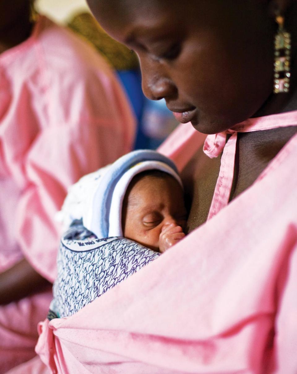 This handout photo provided by Save the Children taken on Jan. 8, 2010, shows a mother carrying her unnamed twin baby, 11 days old, in the Kangaroo Care center at the Gabrielle Traoré Hospital in Bamako, Mali. The babies were born one week premature. About 15 million premature babies are born every year _ more than 1 in 10 of the world’s births and a bigger problem than previously believed, according to the first country-by-country estimates of this obstetric epidemic. The startling toll: 1.1 million of these fragile newborns die as a result, and even those who survive can suffer lifelong disabilities. Photo by Joshua Roberts/Save the Children.