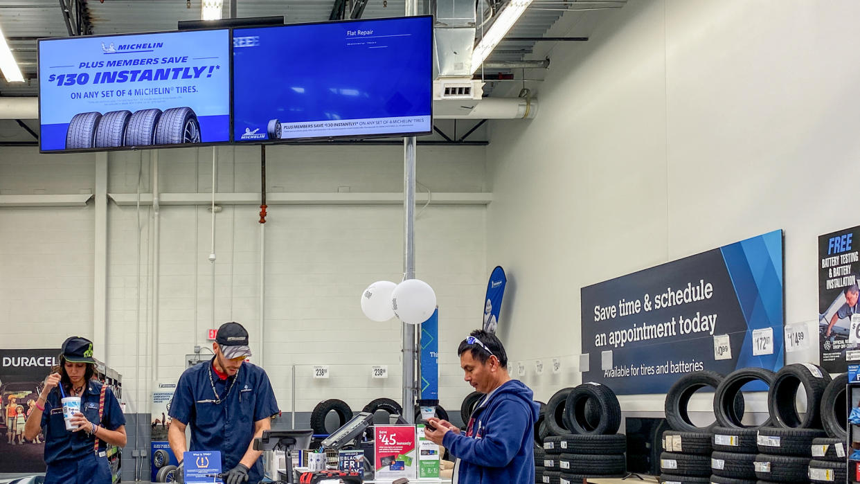 Orlando,FL/USA -11/16/19: The Tire and Battery aisle of a Sams Club Wholesale retail store with a variety of tires and batteries ready to be purchased by consumers.