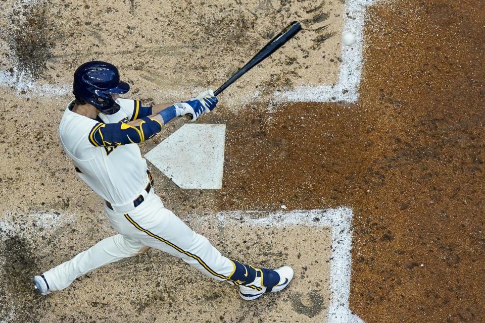 Milwaukee Brewers' Christian Yelich hits a single during the fourth inning of a baseball game against the Pittsburgh Pirates Thursday, Aug. 3, 2023, in Milwaukee. (AP Photo/Morry Gash)