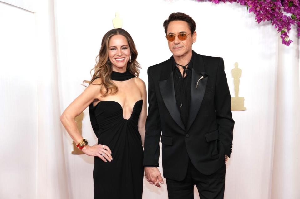 The couple hold hands at the 2024 Oscars. FilmMagic