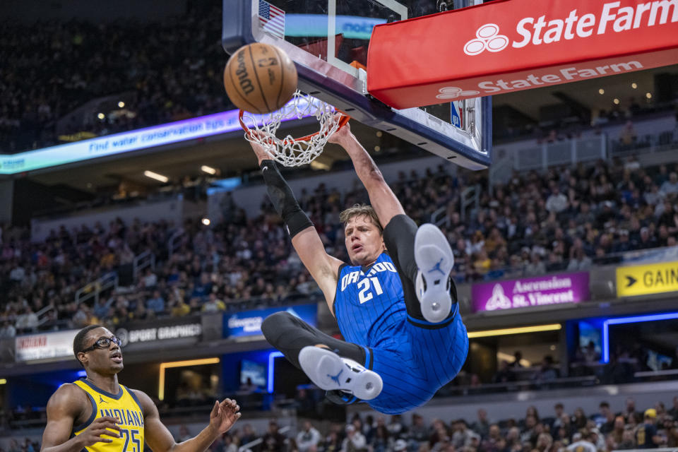 Orlando Magic center Moritz Wagner (21) scores with a dunk during the first half of an NBA basketball game against the Indiana Pacers in Indianapolis, Sunday, Nov. 19, 2023. (AP Photo/Doug McSchooler)