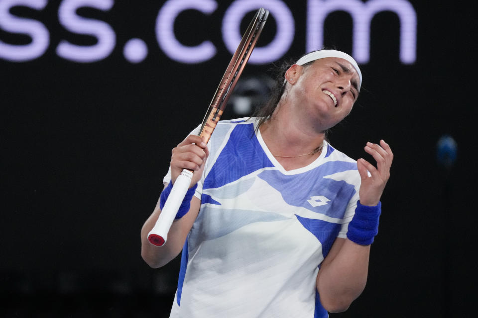 Ons Jabeur of Tunisia reacts after losing a point to Marketa Vondrousova of the Czech Republic during their second round match at the Australian Open tennis championship in Melbourne, Australia, Thursday, Jan. 19, 2023. (AP Photo/Dita Alangkara)