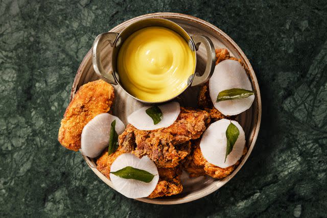 <p>Rebecca Hope</p> Keralan fried chicken with curry leaf mayonnaise and pickled radish at Kricket