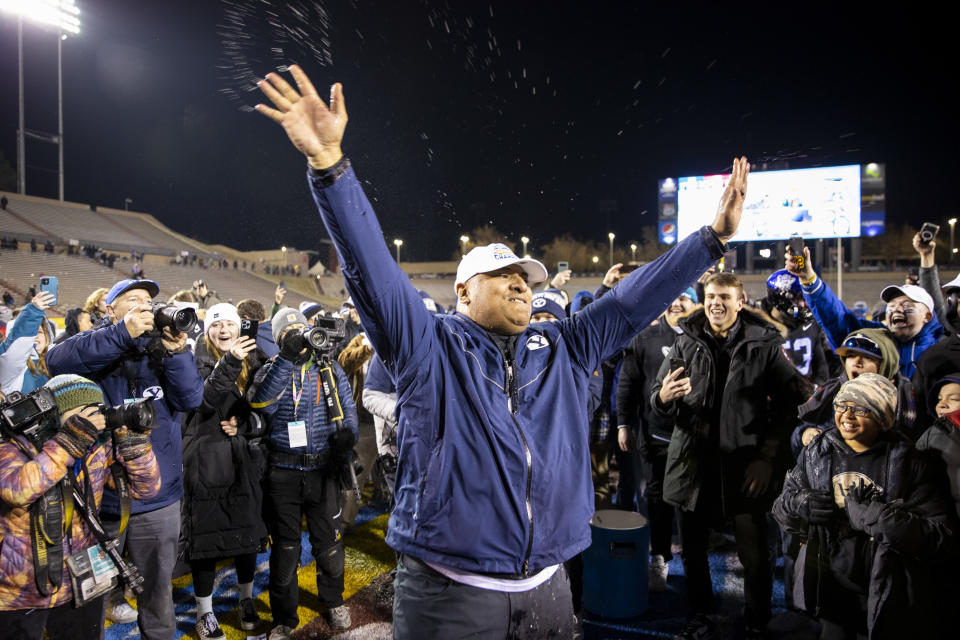 Dec 17, 2022; Albuquerque, New Mexico, USA; Brigham Young Cougars head coach Kalani SitakeÊblows a kiss to fans after being given a Gatorade bath after defeating the Southern Methodist Mustangs at University Stadium (Albuquerque). Ivan Pierre Aguirre-USA TODAY Sports