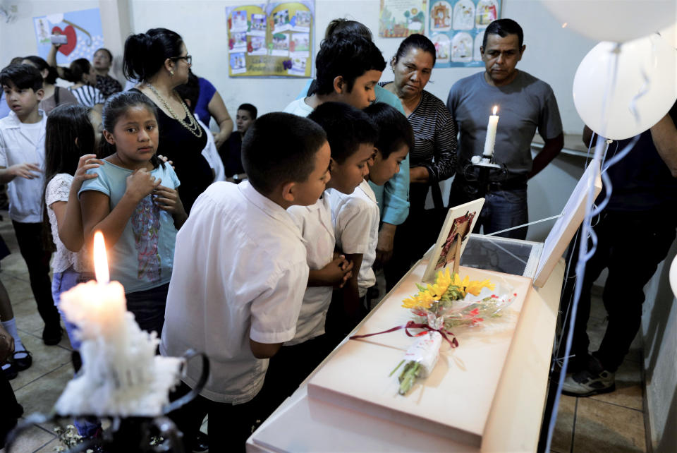 In this Sept. 18, 2019, photo, schoolmates of Gerardo Enmanuel Hernández, 6, stand in front of his coffin during his funeral in a chapel in Tegucigalpa, Honduras. Honduras already has by far the highest death rate from dengue in Latin America this year. And the country’s most prevalent strain of dengue also happens to be the most aggressive and the deadliest. (AP Photo/Elmer Martinez)