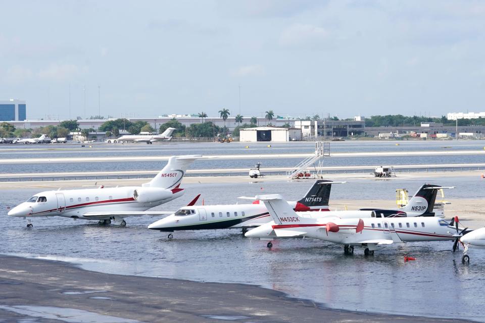 Small planes are parked at Fort Lauderdale-Hollywood International Airport, after the airport was force to shut down due to flooding, Thursday, April 13, 2023, in Fort Lauderdale, Fla.