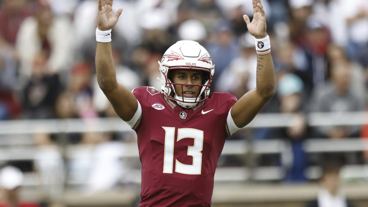 Florida State quarterback Jordan Travis (13) celebrates a touchdown during the first half of an NCAA football game against the Boston College Eagles on Saturday, Sept. 16, 2023, in Chestnut Hill, Mass. (AP Photo/Greg M. Cooper)