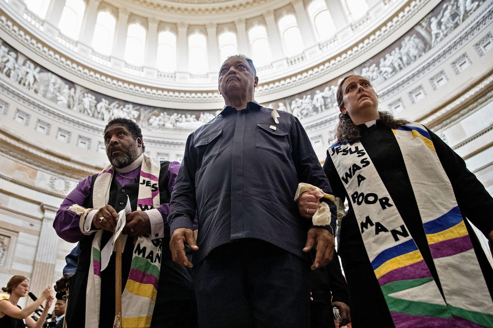The Rev. William Barber, the Rev. Jesse Jackson and the rev. Liz Theoharis lead protesters through the U.S. Capitol Rotunda before being arrested on May 21. (Photo: Chip Somodevilla via Getty Images)