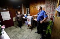 A woman casts her vote during the country's direct presidential election, at a polling station in Prague, the Czech Republic January 12, 2018. REUTERS/David W Cerny