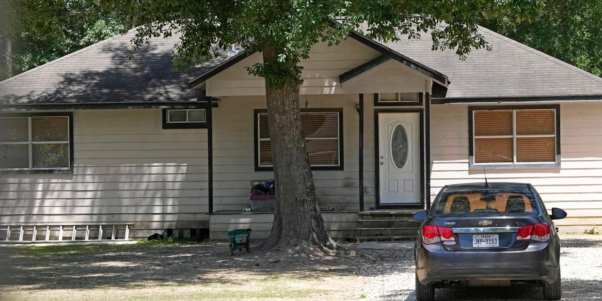 Front porch and driveway of Cleveland, Texas, home.