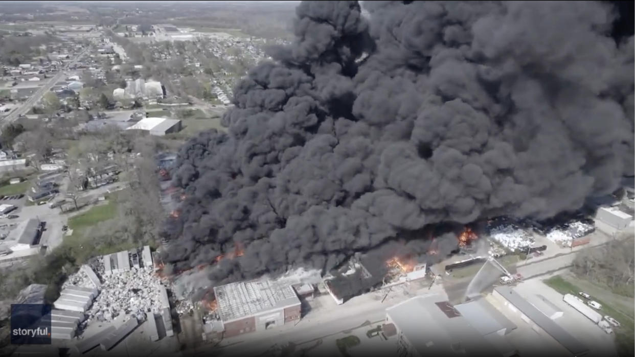 Thick black smoke rises from an industrial fire in Richmond, Ind.