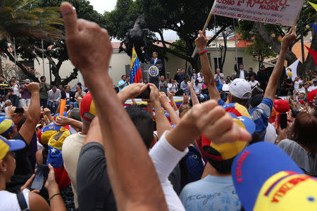 Venezuelan opposition leader Juan Guaido, who many nations have recognised as the country's rightful interim ruler, takes part in a gathering with supporters in Caracas, Venezuela, April 19, 2019. REUTERS/Manaure Quintero