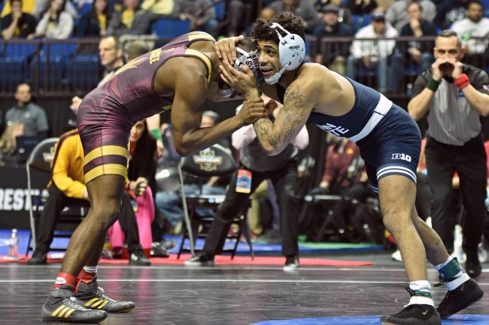 Penn State’s Roman Bravo-Young hand fights with Arizona State’s Michael McGee in their 133-pound semifinals match of the NCAA Championships on Friday, March 17, 2023 at the BOK Center in Tulsa, Okla. Bravo-Young topped McGee, 6-4, in sudden victory.