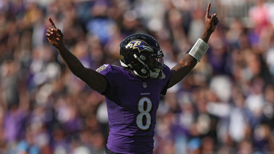 BALTIMORE, MARYLAND - OCTOBER 17: Lamar Jackson #8 of the Baltimore Ravens celebrates a touchdown against the Los Angeles Chargers during the fourth quarter at M&T Bank Stadium on October 17, 2021 in Baltimore, Maryland. (Photo by Patrick Smith/Getty Images)