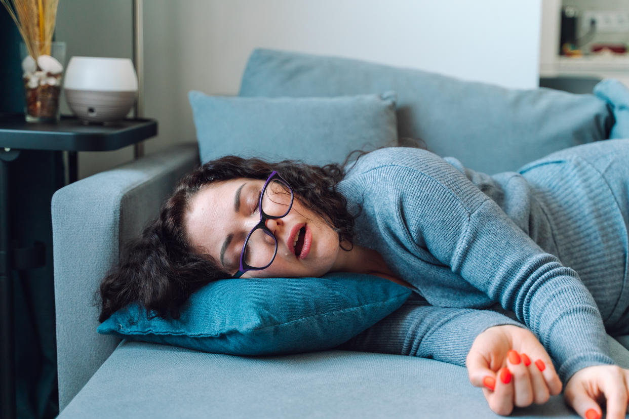 Funny image of sleeping middle age woman wearing glasses napping