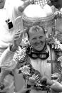 FILE - A.J. Foyt celebrates after winning the 48th Indianapolis 500 auto race, in Indianapolis, Ind., on May 30, 1964. (AP Photo/File)