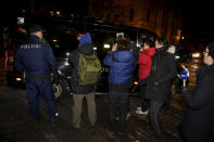 Photographers take pictures of a van carrying members of the North Korean delegation, who dined in the Restaurant Saaga in Helsinki, Finland March 19, 2018. Lehtikuva/Jussi Nukari via REUTERS