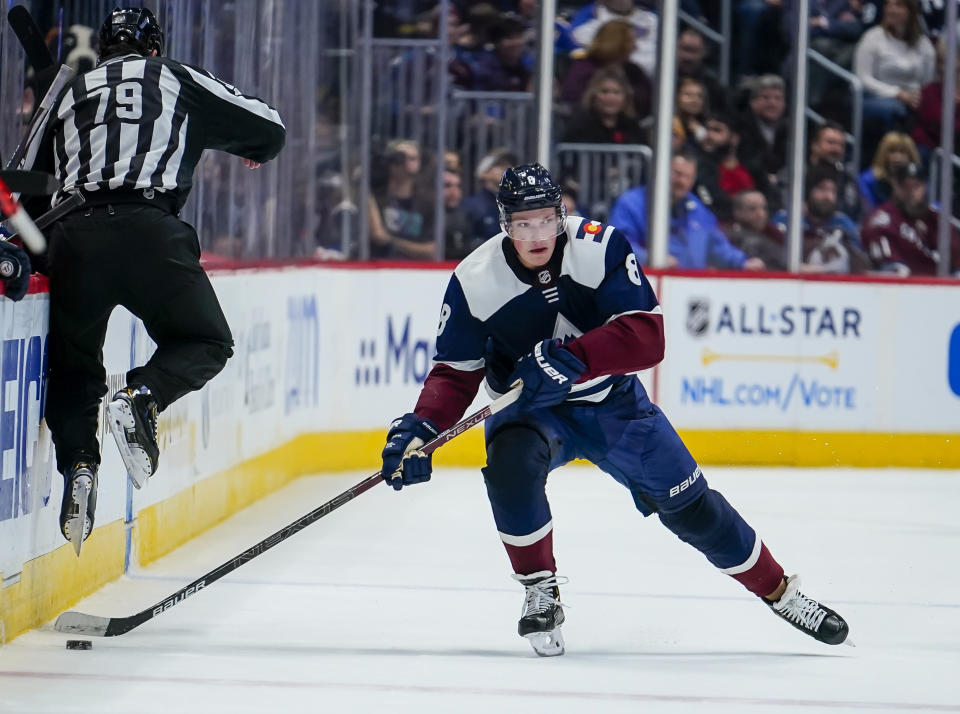 FILE - In this Thursday, Jan. 2, 2020, file photo Colorado Avalanche defenseman Cale Makar skates against the St. Louis Blues during the third period of an NHL hockey game in Denver. Bonding between veterans and youngsters has been a time-honored tradition in hockey, with older players routinely inviting rookies to live with them during their first season. That’s the way it was for Avalanche defenseman Cale Makar, who bunked with the family of teammate Matt Calvert when he first arrived before last season. This season, though, is just different. (AP Photo/Jack Dempsey, File)