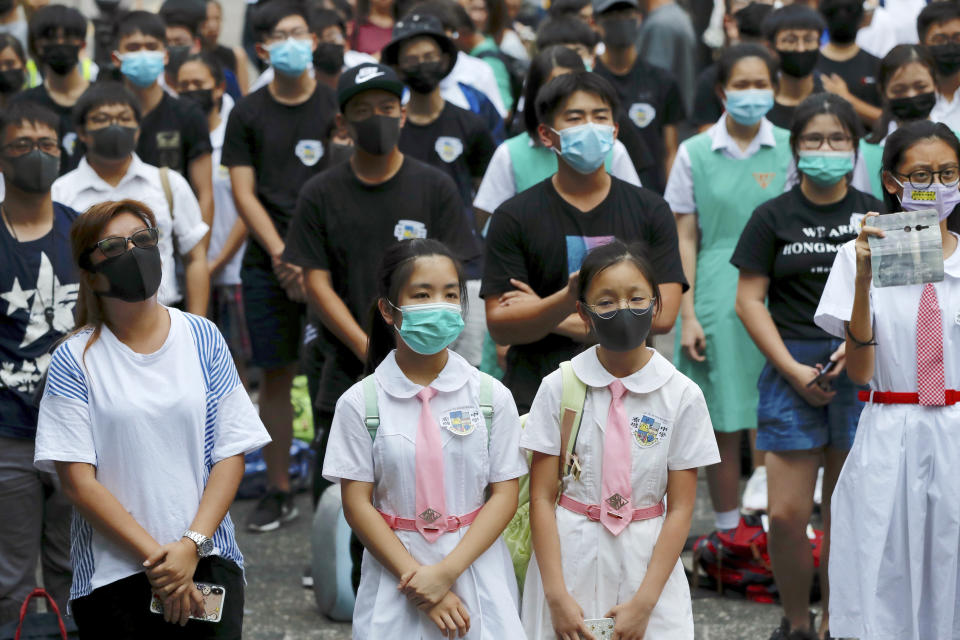 Students gather during a school children's strike event in support of protest movement in Hong Kong Monday, Sept. 30, 2019. Hong Kong authorities Monday rejected an appeal for a major pro-democracy march on National Day’s holiday after two straight days of violent clashes between protesters and police in the semi-autonomous Chinese territory roused fears of more showdowns that would embarrass Beijing. (AP Photo/Gemunu Amarasinghe)