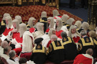 Members of the House of Lords take their seats in the chamber for the State Opening of Parliament by Queen Elizabeth II, in the House of Lords at the Palace of Westminster in London, Thursday Dec. 19, 2019. (Aaron Chown, Pool via AP)