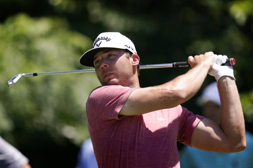 Sam Burns hits off the eighth tee during the first round of the Charles Schwab Challenge.