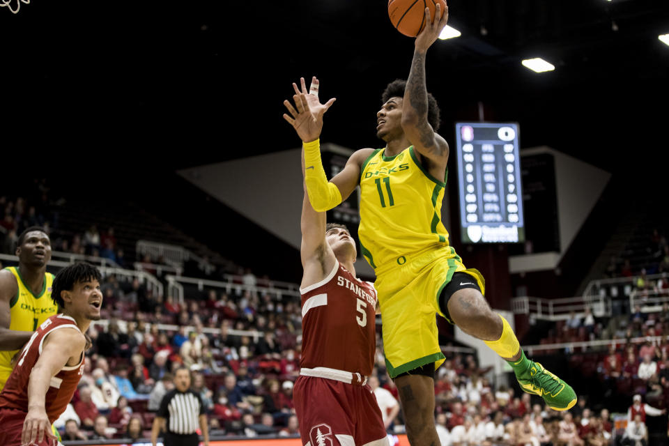 Oregon guard Rivaldo Soares (11) shoots next to Stanford guard Michael O'Connell (5) during the second half of an NCAA college basketball game in Stanford, Calif., Saturday, Jan. 21, 2023. Stanford won 71-64. (AP Photo/John Hefti)