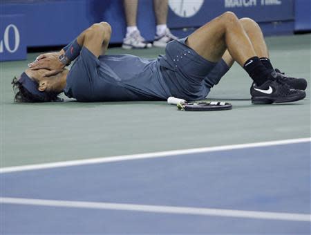 Rafael Nadal of Spain celebrates after defeating Novak Djokovic of Serbia in their men's final match at the U.S. Open tennis championships in New York, September 9, 2013. REUTERS/Kena Betancur