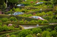 San Francisco's Lombard Street has become one of the city's most visited sites. Tourists often gather to watch as drivers make their way through the hairpin turns. Completed in 1922, the street was designed to slow cars down on its steep hill. Drivers are advised to proceed at 5 m.p.h.