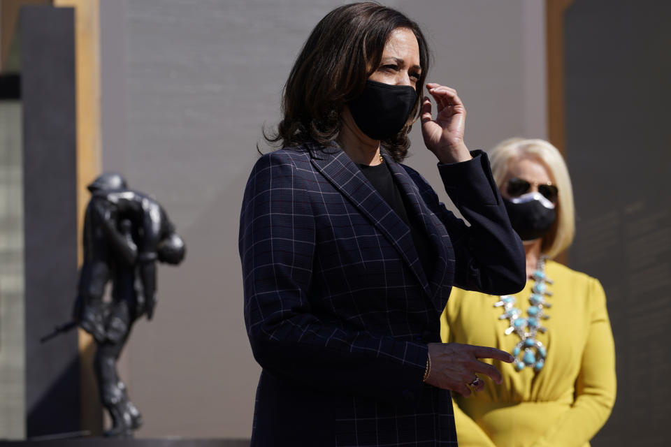 Vice presidential candidate Sen. Kamala Harris, D-Calif., and Cindy McCain listen as they visit the American Indian Veterans National Memorial with tribal leaders and veterans at Heard Museum in Phoenix, Thursday, Oct. 8, 2020. (AP Photo/Carolyn Kaster)