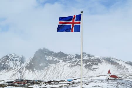 Iceland's national flag and a church are seen in the town of Vik, Iceland April 22, 2010. REUTERS/Lucas Jackson/File Photo