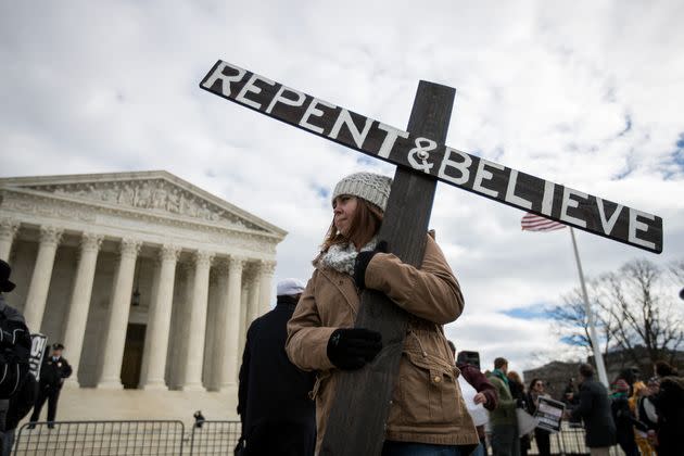 An anti-abortion advocate holds a cross outside of the Supreme Court during the March for Life, Jan. 27, 2017, in Washington, D.C. (Photo: Drew Angerer via Getty Images)