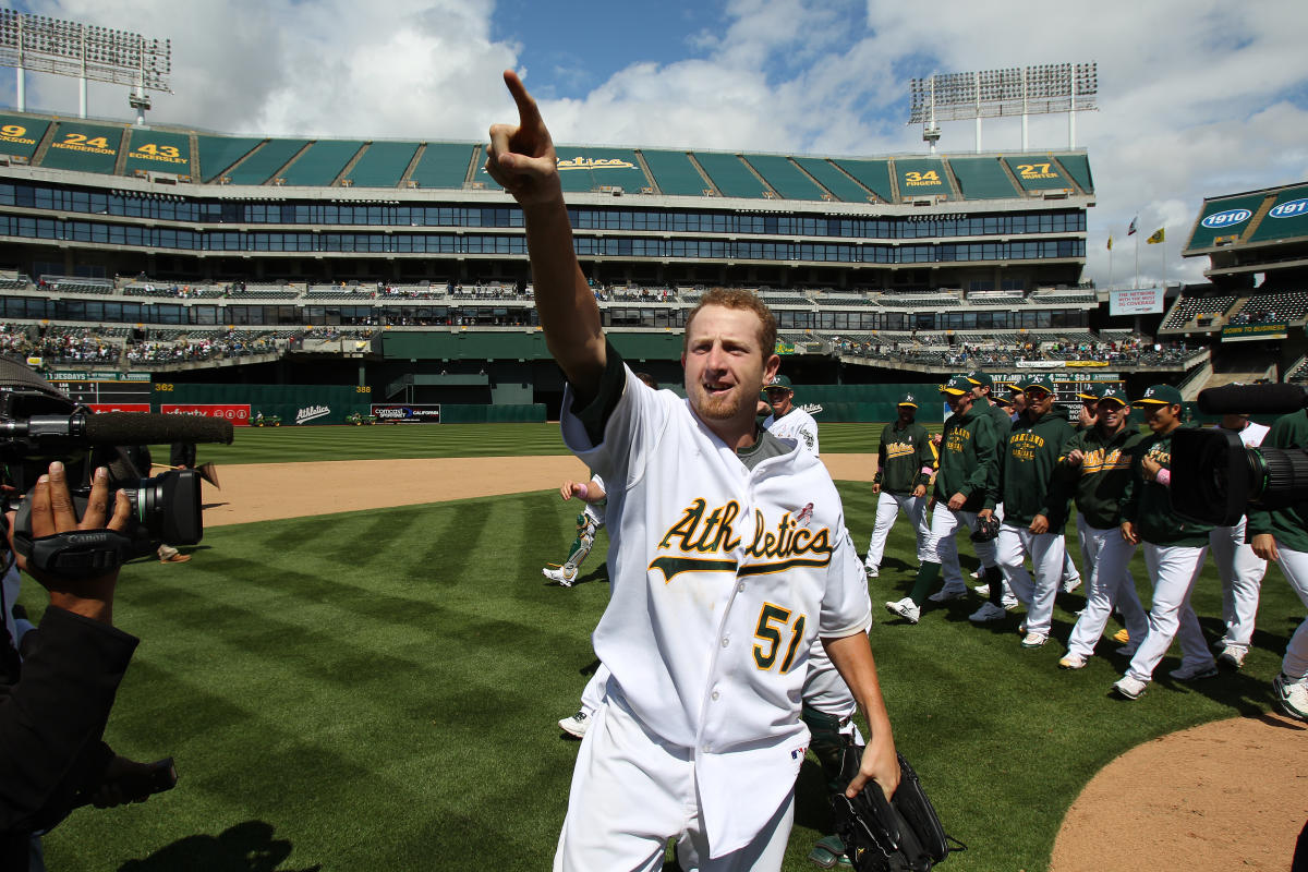 Former Oakland Athletics pitcher Dallas Braden wears a jersey of