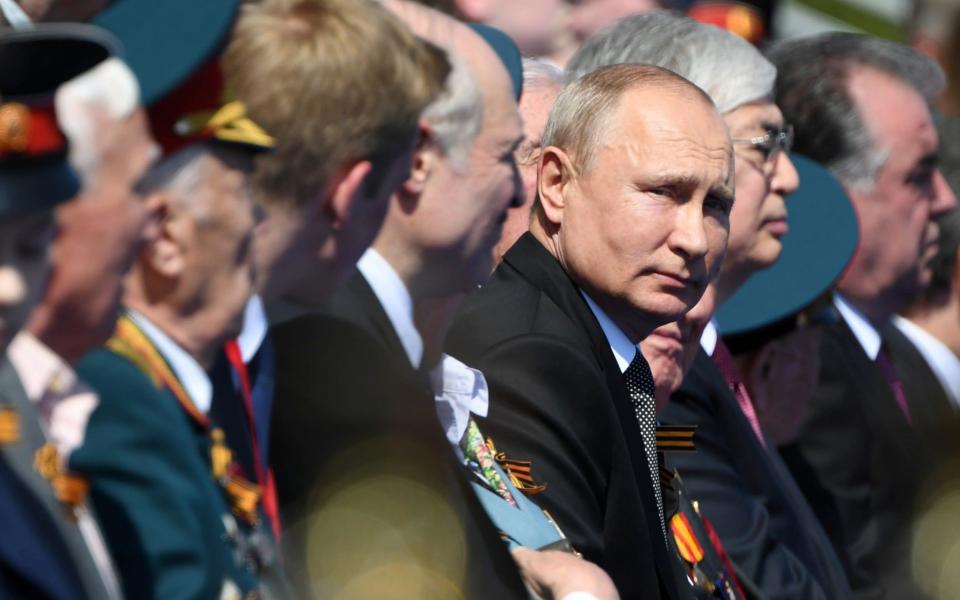 Russian President Vladimir Putin watches the Victory Day parade on Red Square - Sergey Pyatakov/Kremlin pool via Reuters