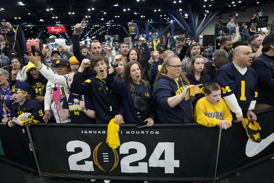 Michigan fans cheer during media day ahead of the national championship NCAA College Football Playoff game between Washington and Michigan Saturday, Jan. 6, 2024, in Houston. The game will be played Monday. (AP Photo/David J. Phillip)