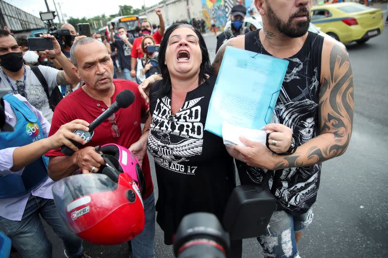 People protest against police violence outside Jacarezinho slum after a police operation which resulted in 25 deaths in Rio de Janeiro