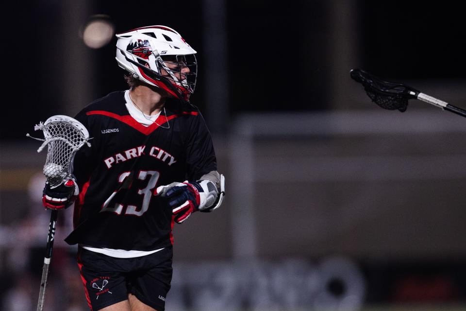 Park City’s Chase Beyer (23) looks past a defender’s stick during the 5A boys lacrosse championships at Zions Bank Stadium in Herriman on May 26, 2023. | Ryan Sun, Deseret News